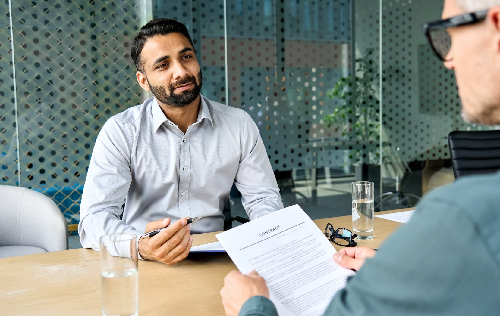 Lawyer Discussing Document with Client